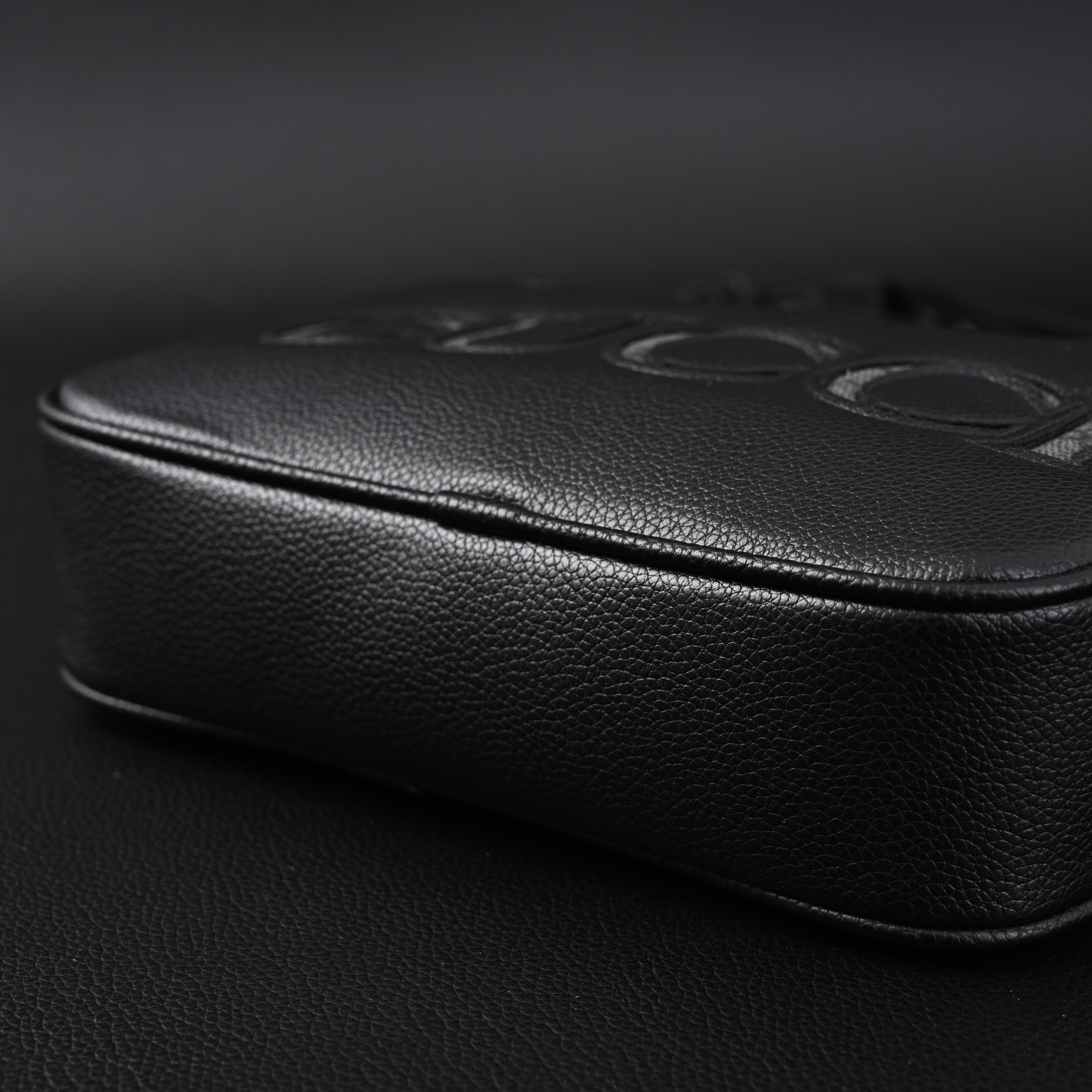 Gucci Black Leather Embossed Logo Belt Bag